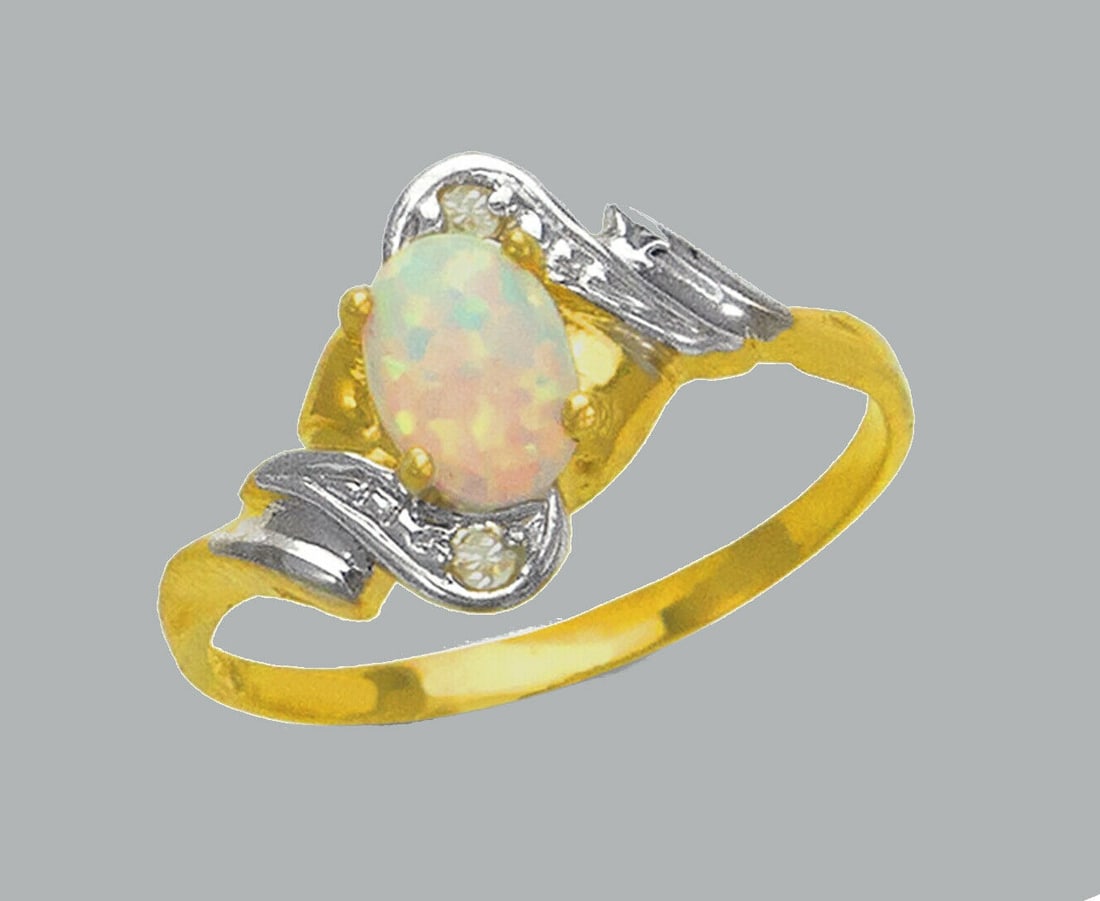NEW 14K TWO TONE GOLD LADIES CZ OPAL COCKTAIL RING: NEW 14K TWO TONE GOLD CZ RING New 14K Two tone solid gold ring Ring size 7 Measures 11mm wide on top Cubic Zirconia Polished Finish Apx Weight: 1.8g
