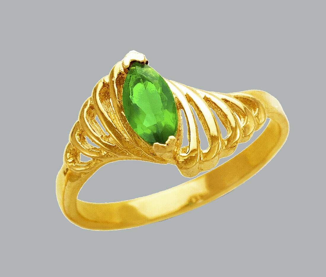NEW 14K YELLOW GOLD LADIES FANCY CZ RING GREEN MARQUISE: NEW 14K YELLOW GOLD CZ RING New 14K Yellow solid gold ring Ring size 7 Measures 11mm wide on top Cubic Zirconia Polished Finish Apx Weight: 2.8g