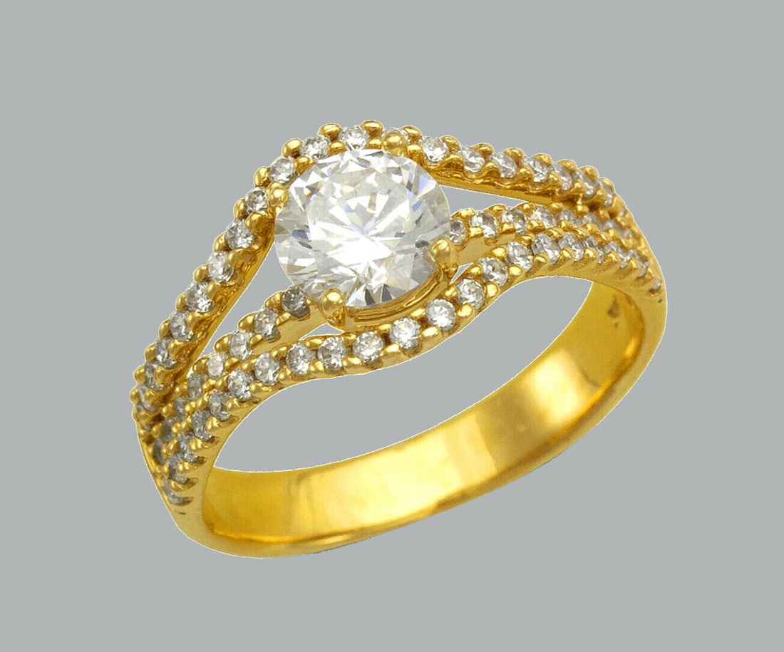 14K YELLOW GOLD LADIES FANCY ENGAGEMENT RING SPLIT SHNK: NEW 14K YELLOW GOLD CZ RING New 14K Yellow solid gold ring Ring size 7 Measures 10mm wide Cubic Zirconia Polished Finish Apx Weight: 4g