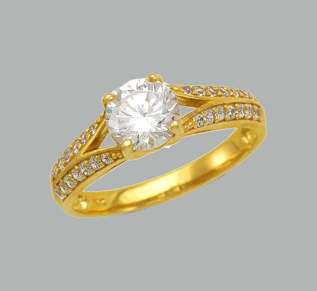 14K YELLOW GOLD LADIES ENGAGEMENT RING SPLIT SHANK: NEW 14K YELLOW GOLD CZ RING New 14K Yellow solid gold ring Ring size 7 Measures 6mm wide Cubic Zirconia Polished Finish Apx Weight: 2.8g