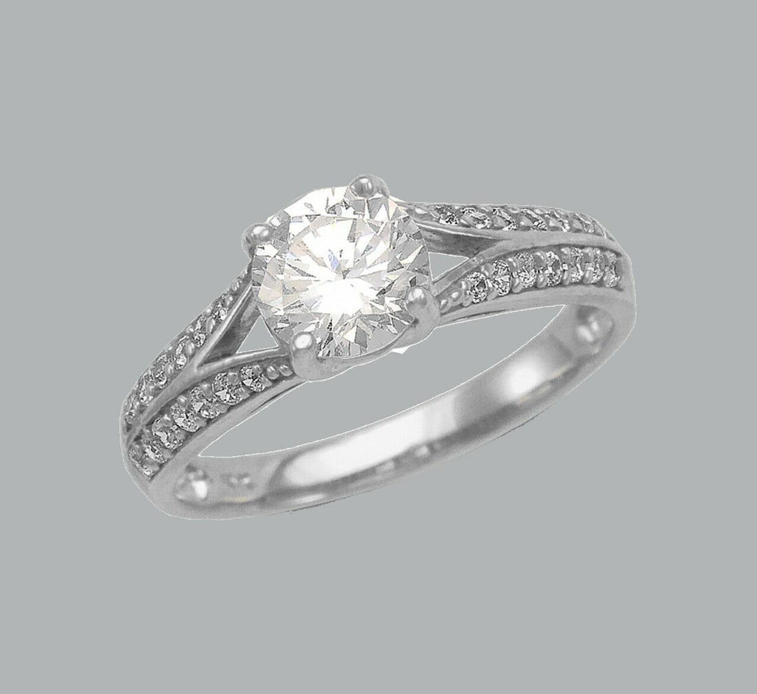 14K WHITE GOLD LADIES ENGAGEMENT RING SPLIT SHANK: NEW 14K WHITE GOLD CZ RING New 14K White solid gold ring Ring size 7 Measures 6mm wide Cubic Zirconia Polished Finish Apx Weight: 2.8g