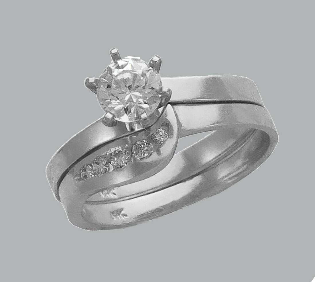 14K WHITE GOLD LADIES CZ ENGAGEMENT RING MATCHING BAND: NEW 14K WHITE GOLD CZ RINGSNew 14K White solid gold rings2 RingsRing size 7Measures, 3mm wide bandCubic Zirconia Polished Finish Apx Weight: 5.3g
