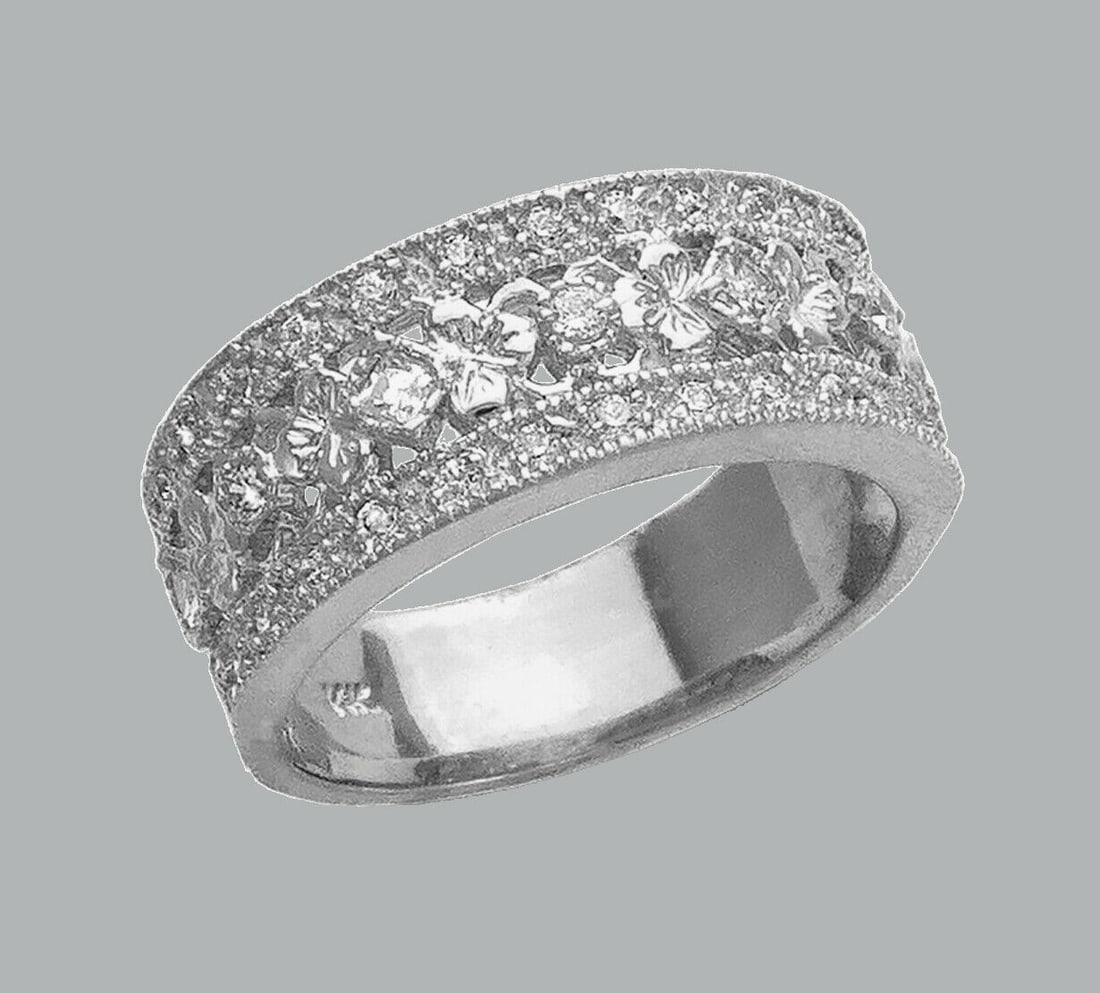 14K WHITE GOLD LADIES CZ RING FILIGREE BAND FLOWER: NEW 14K WHITE GOLD CZ RINGNew 14K White solid gold ringRing size 7Measures 8mm wide on topCubic Zirconia Polished FinishApx Weight: 6.2g