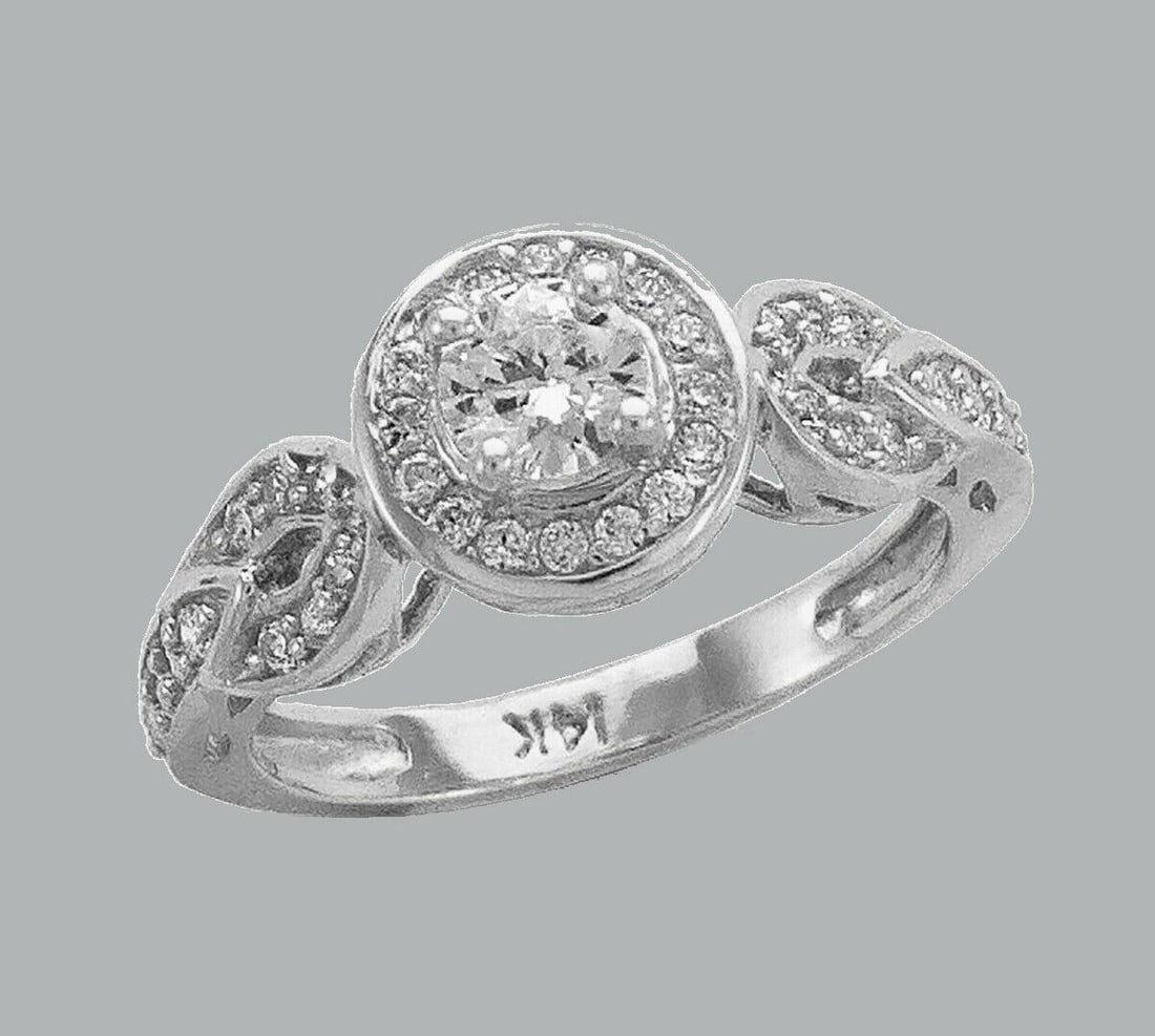 14K WHITE GOLD LADIES FANCY CZ ENGAGEMENT RING HALO: NEW 14K WHITE GOLD CZ RING New 14K White solid gold ring Ring size 7 Measures 9mm Wide Cubic Zirconia Polished Finish Apx Weight: 4.7g