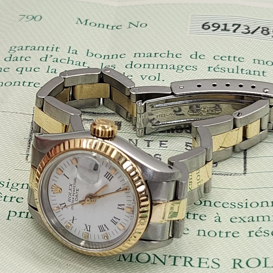W/PAPERS 1986 ROLEX LADIES DATE 26 MM STEEL 18K YELLOW GOLD OYSTER WATCH 69173: W/PAPERS 1986 ROLEX LADIES DATE 26 MM STEEL 18K YELLOW GOLD OYSTER WATCH 69173 Condition: Pre-owned - Good: This item has been gently used but is in good condition. It might have a few signs ... Read
