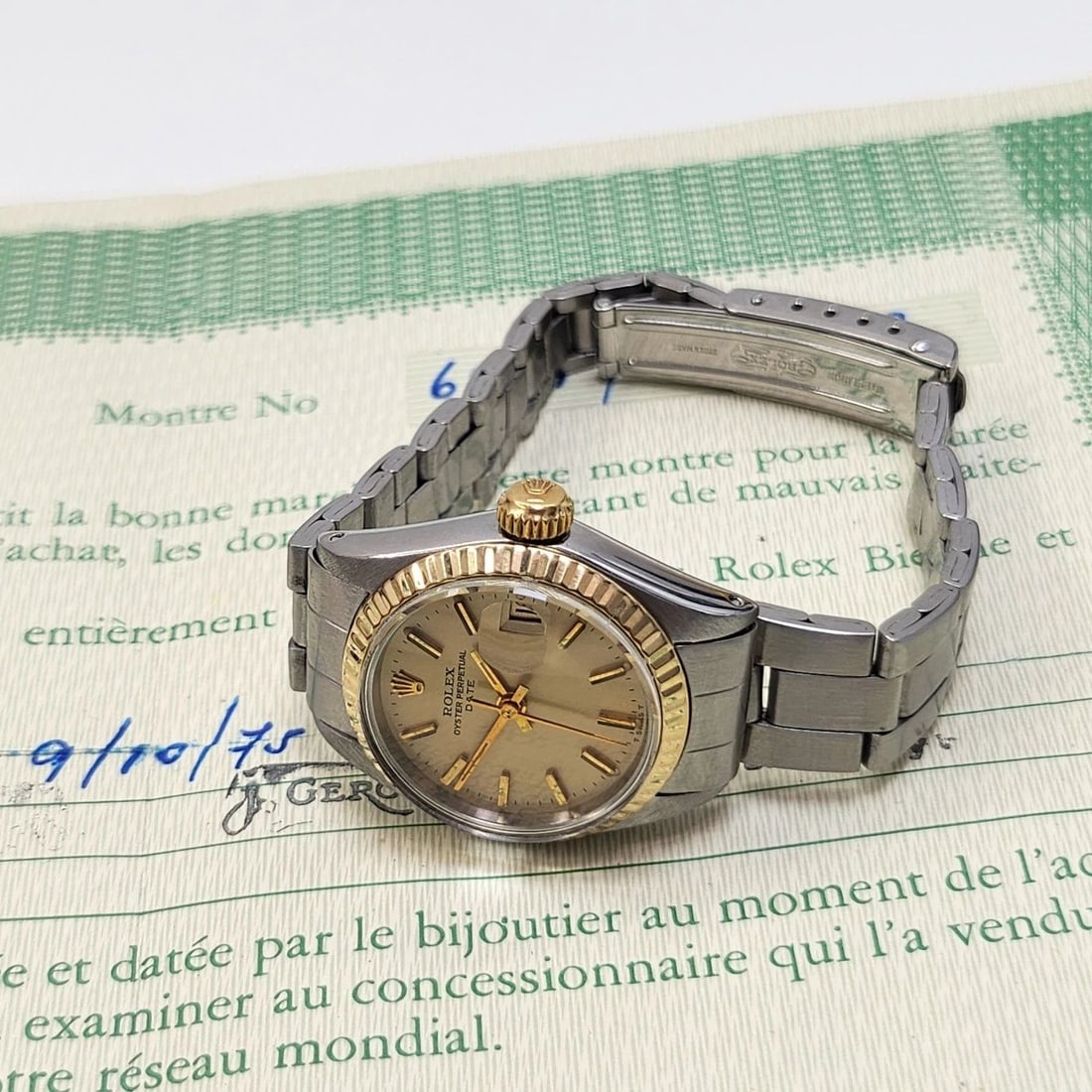 W/PAPERS 1975 ROLEX LADIES DATE 26 MM TWO TONE OYSTER CHAMPAGNE WATCH 6917: W/PAPERS 1975 ROLEX LADIES DATE 26 MM TWO TONE OYSTER CHAMPAGNE WATCH 6917 Condition: Pre-owned - Good: This item has been gently used but is in good condition. It might have a few signs ... Read more