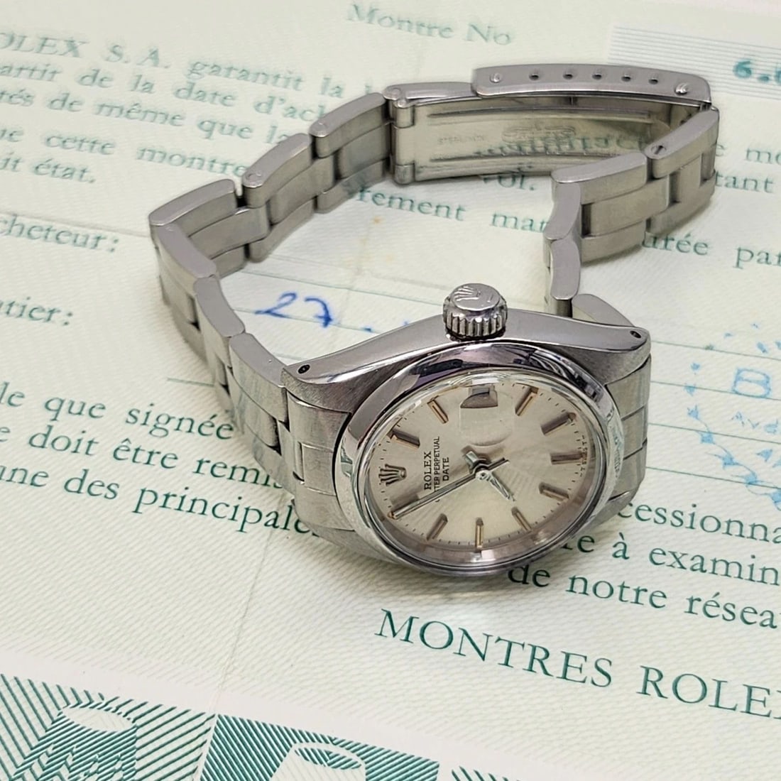 W/PAPERS 1980 ROLEX LADIES DATE 26 MM STEEL OYSTER SILVER AUTOMATIC WATCH 6916: W/PAPERS 1980 ROLEX LADIES DATE 26 MM STEEL OYSTER SILVER AUTOMATIC WATCH 6916 Condition: Pre-owned - Good: This item has been gently used but is in good condition. It might have a few signs ... Read