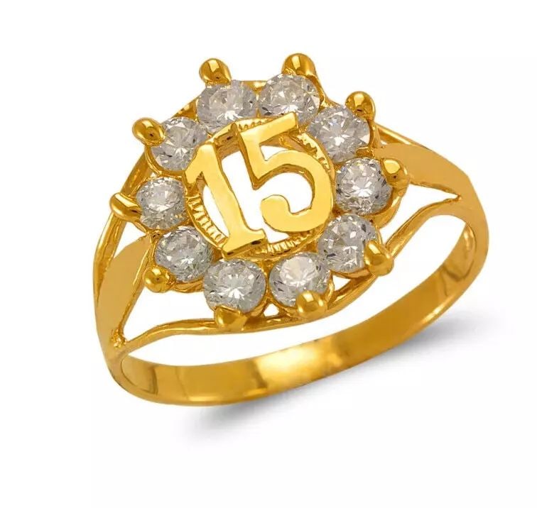 NEW 14K YELLOW GOLD LADIES 15 ANOS CZ RING: NEW 14K YELLOW GOLD LADIES 15 ANOS CZ RING 14K Yellow Gold Size 7 Approx. 13.5mm Center, 2mm Band High Polished/Cubic Zirconia Weight: 2.2 Grams