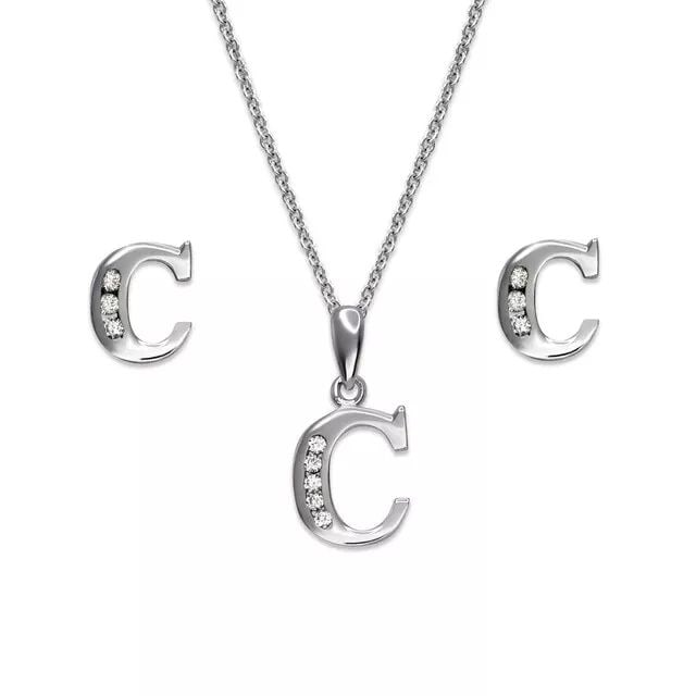 NEW 14K WHITE GOLD INIEARRINGS PENDANT TIAL " C " COLLECTION SET: NEW 14K WHITE GOLD INITIAL " C " COLLECTION SET 14K White Gold Approx. Measurements: Earrings- 5.5x7mm, Pendant- 8x10mm High Polished/Cubic Zirconia Items in this Set: Earrings, Pendant Chains Sold Se
