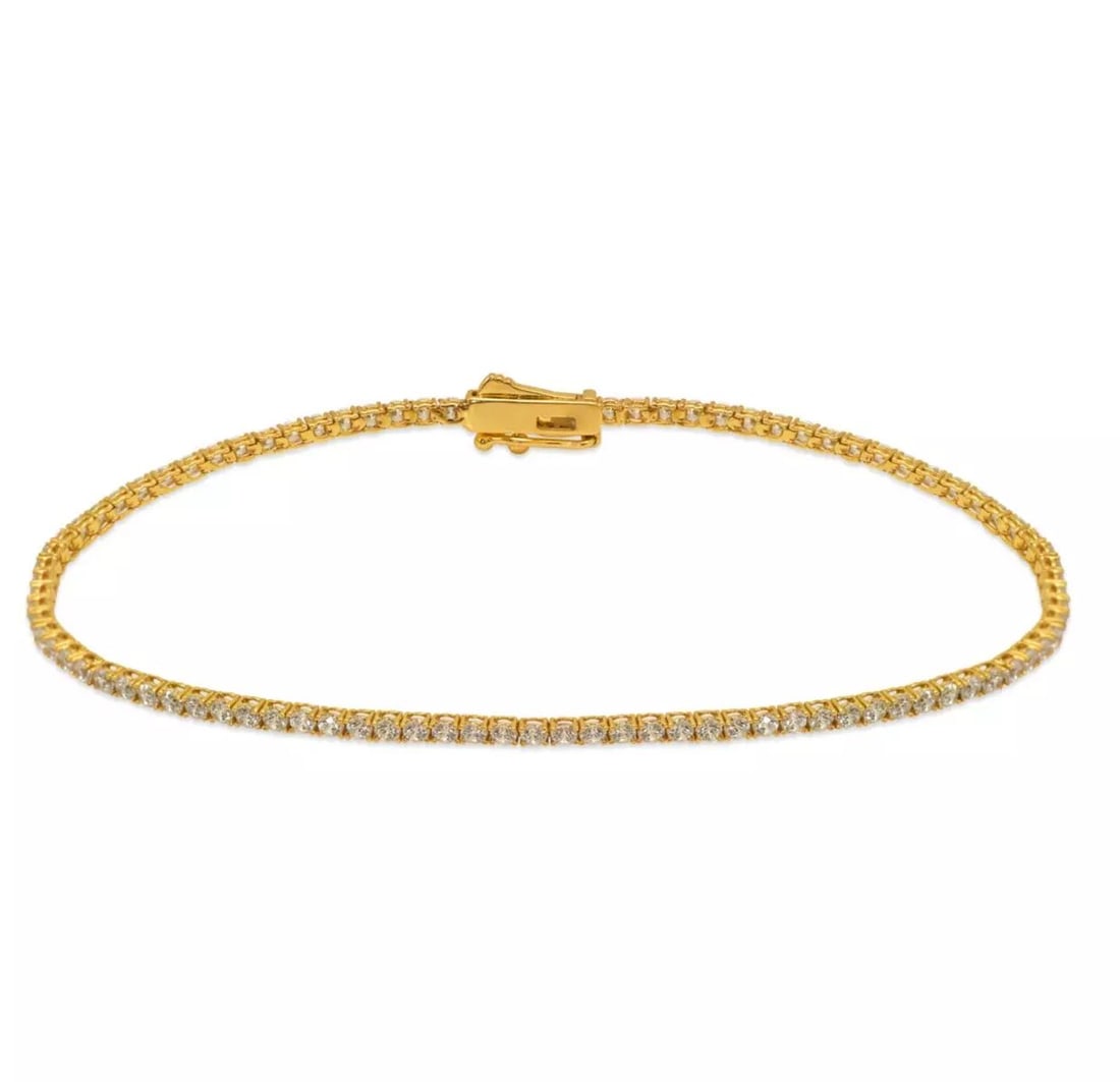 NEW 14K YELLOW GOLD ROUND PAVE CZ TENNIS BRACELET 2.5 mm: NEW 14K YELLOW GOLD ROUND PAVE CZ TENNIS BRACELET 2.5 mm 14K Yellow Gold Approx. 2.5mm Stone Cubic Zirconia Available in White Gold Box Clasp Length : 7" Inch Weight: 5.5 Grams