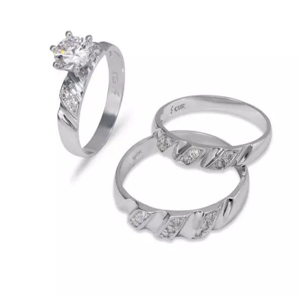 NEW 14K WHITE GOLD WEDDING TRIO RING SET: NEW 14K WHITE GOLD WEDDING TRIO RING SET 14K White Gold Ladies band and engagement ring is size 7 Men's ring is size 10 Rings Also Sold Separately Available in Yellow Gold Weight: 7.6 Grams