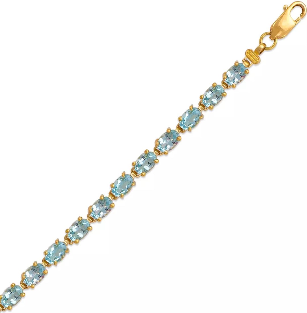 NEW 14K YELLOW GOLD MYSTIC TOPAZ BRACELET: NEW 14K YELLOW GOLD MYSTIC TOPAZ BRACELET 14K Yellow Gold Light Blue Cubic Zirconia Lobster lock Length : 7" Inch Weight: 8.4 Grams