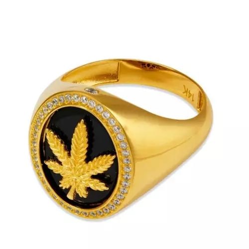 NEW 14K YELLOW GOLD MEN'S MARIJUANA RING: NEW 14K YELLOW GOLD MEN'S MARIJUANA RING 14K Yellow Gold Approx. 20mm Center, 4mm Band High Polished/Cubic Zirconia Weight: 7.8 Grams