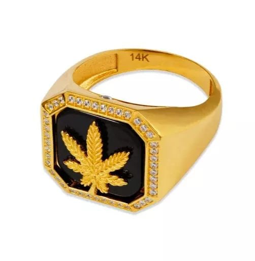 NEW 14K YELLOW GOLD MEN'S MARIJUANA RING: NEW 14K YELLOW GOLD MEN'S MARIJUANA RING 14K Yellow Gold Approx. 18mm Center, 4mm Band High Polished/Cubic Zirconia Weight: 8.3 Grams