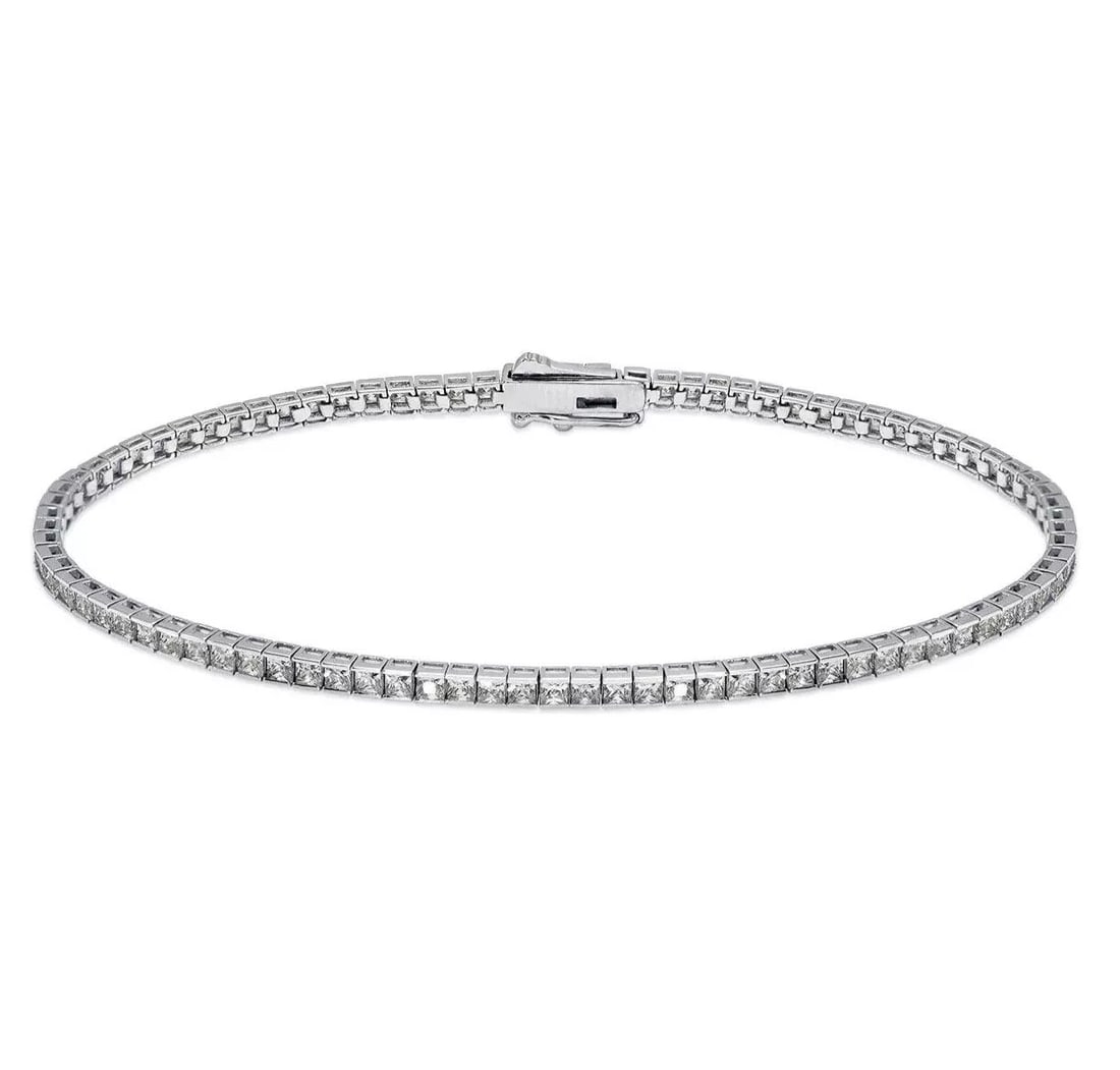 NEW 14K WHITE GOLD CHANNEL SET TENNIS CZ BRACELET 1.75 mm: NEW 14K WHITE GOLD CHANNEL SET TENNIS CZ BRACELET 1.75 mm 14K White Gold Approx. 1.75mm Stone Cubic Zirconia Available in Yellow Gold Box Clasp Length : 7" Inch Weight: 5.3 Grams