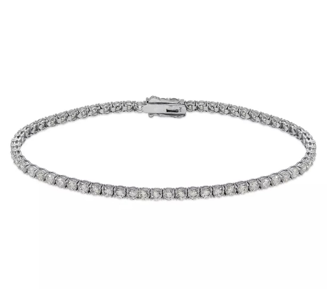 NEW 14K WHITE GOLD ROUND PAVE TENNIS CZ BRACELET 2.5 mm: NEW 14K WHITE GOLD ROUND PAVE TENNIS CZ BRACELET 2.5 mm 14K White Gold Approx. 2.5mm Stone Cubic Zirconia Available in Yellow Gold Box Clasp Length : 7" Inch Weight: 5.5 Grams