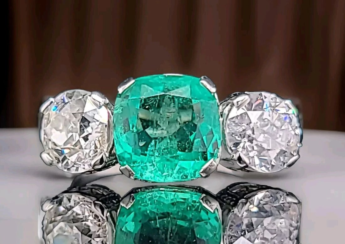 VINTAGE PLATINUM ENGAGEMENT RING 6.37CT. NATURAL COLOMBIA EMERALD OLD EURO DIA: VINTAGE PLATINUM ENGAGEMENT RING 6.37CT. NATURAL COLOMBIA EMERALD OLD EURO DIA This exquisite Filigree Platinum Engagement Ring boasts a stunning 3.42ct. natural Colombia emerald, set in a three-stone