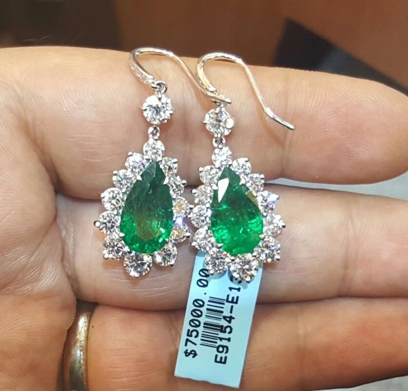 18K WHITE GOLD NATURAL COLOMBIAN EMERALD EARRINGS 10.83CT PEAR SHAPE: 18K WHITE GOLD NATURAL COLOMBIAN EMERALD EARRINGS 10.83CT PEAR SHAPE Gorgeous 18k white gold Colombian emerald earrings 7.12ct total weight natural green Colombian emerald in pear shape clean, nice cu