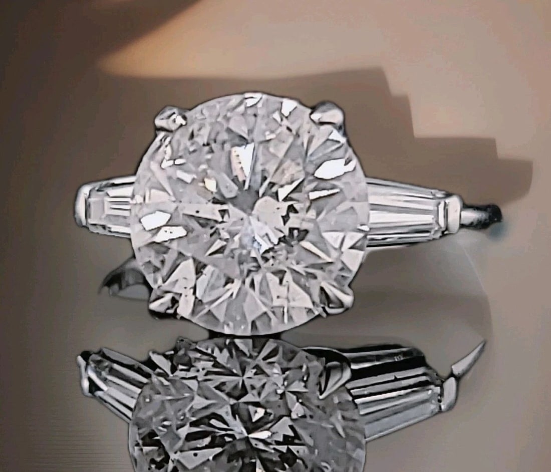 VINTAGE PLATINUM ENGAGEMENT RING 4.07CT.NATURAL ROUND CUT DIAMOND AGI CERT: VINTAGE PLATINUM ENGAGEMENT RING 4.07CT.NATURAL ROUND CUT DIAMOND GIA CERT This vintage platinum engagement ring boasts a stunning 4.07 carat natural round cut diamond in a solitaire with accents styl