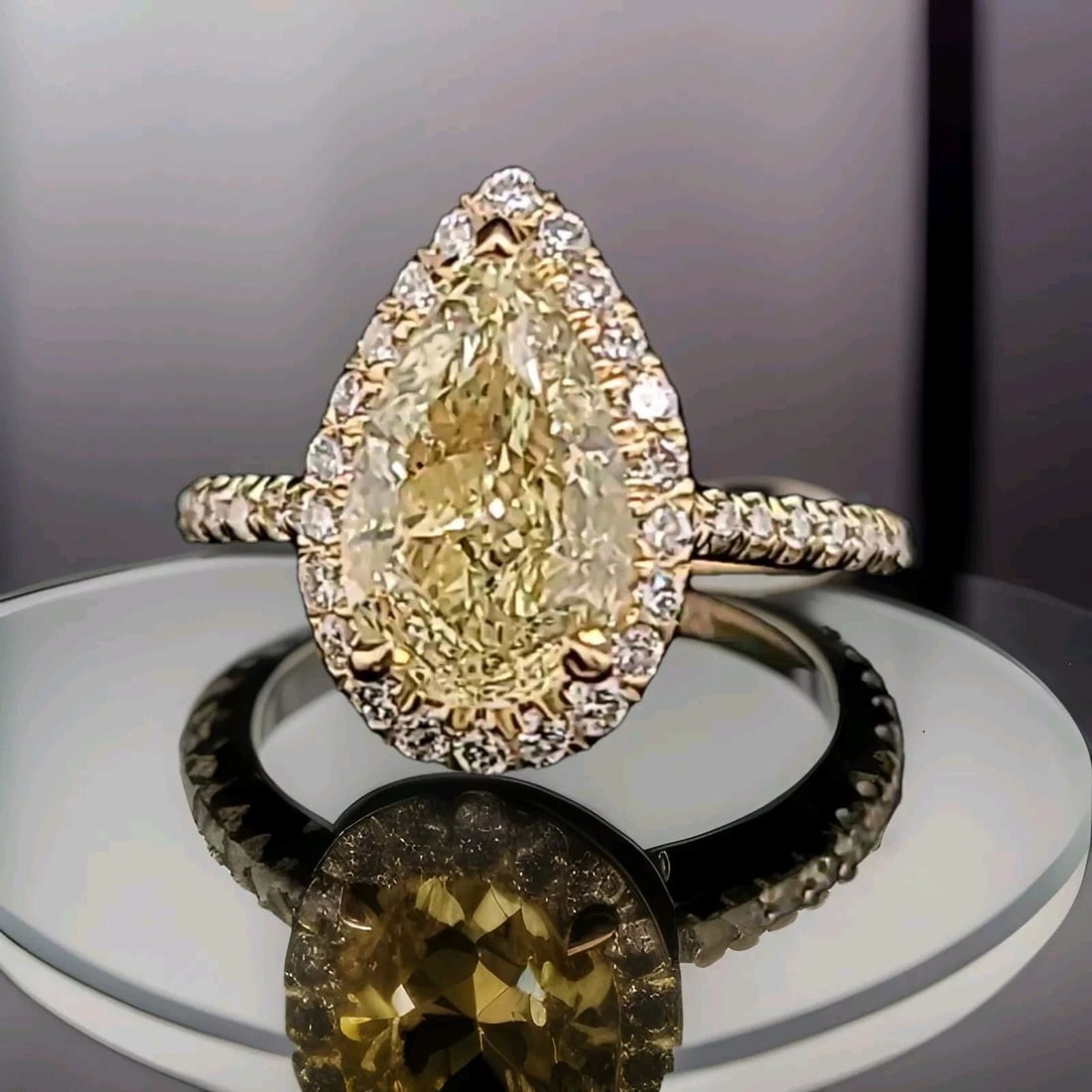 14K YELLOW GOLD ENGAGEMENT RING 2.50CT. NATURAL PEAR CUT YELLOW DIAMOND GIA CERT: 14K YELLOW GOLD ENGAGEMENT RING 2.50CT. NATURAL PEAR CUT YELLOW DIAMOND GIA CERT This stunning 14k yellow gold engagement ring features a 2.50 carat natural pear cut yellow diamond, graded excellent b