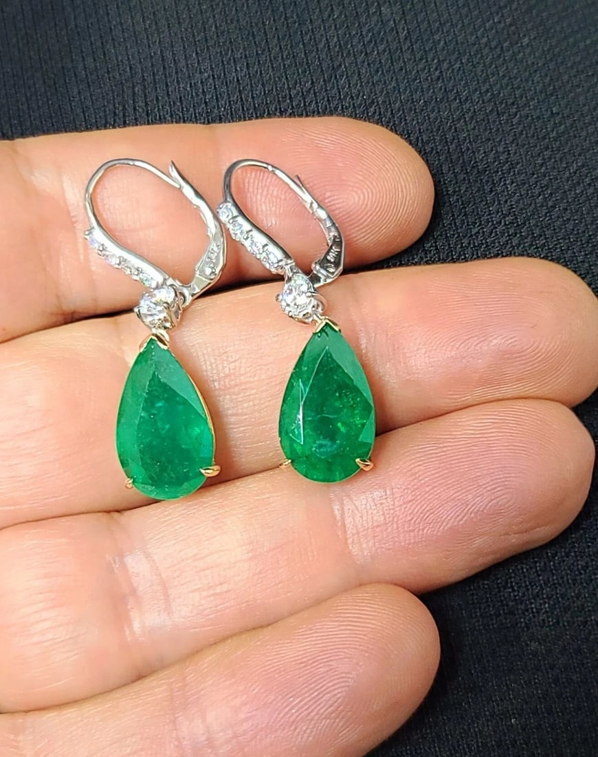 14K TWO-TONE GOLD GEM NATURAL GREEN EMERALD DROP EARRINGS 11.92CT PEAR GIA CERT: 14K TWO-TONE GOLD GEM NATURAL GREEN EMERALD DROP EARRINGS 11.92CT PEAR GIA CERT These 14k two-tone gold drop earrings feature natural green emerald stones in pear shape, totaling 11.92CT. The earrings