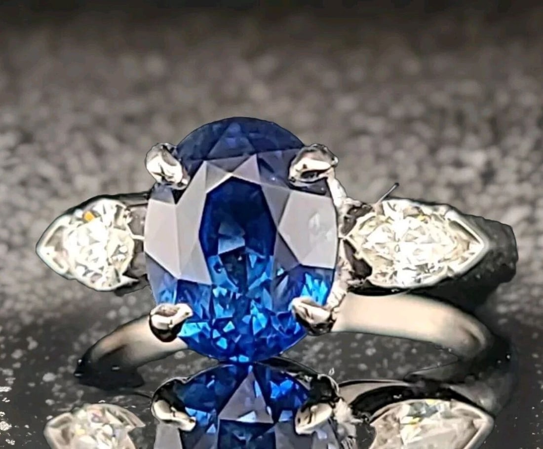 VINTAGE PLATINUM ENGAGEMENT RING 3.76CT.NATURAL UNTREATED OVAL BLUE SAPPHIRE GIA: VINTAGE PLATINUM ENGAGEMENT RING 3.76CT.NATURAL UNTREATED OVAL BLUE SAPPHIRE GIA This stunning vintage platinum engagement band showcases a beautiful oval-shaped blue sapphire gemstone, with a total c