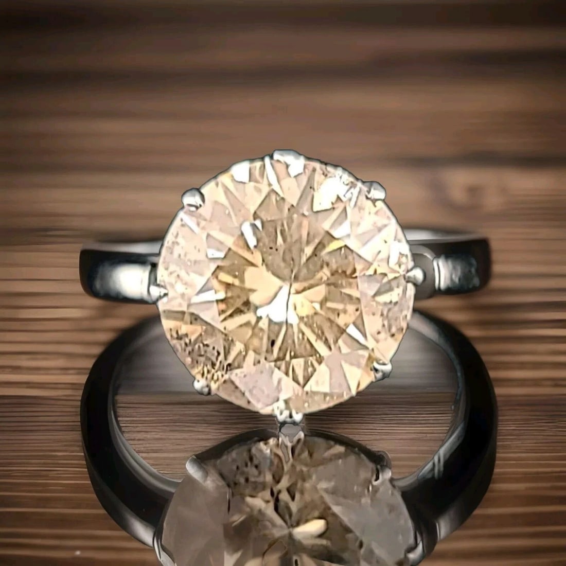 PLATINUM VINTAGE ENGAGEMENT RING 5.15CT. NATURAL ROUND CHAMPAGNE DIAMOND 1930'S: 5.15CT. PLATINUM VINTAGE ENGAGEMENT RING NATURAL ROUND CHAMPAGNE DIAMOND 1930'S This exquisite vintage platinum ring is a true beauty that will make any woman feel special. Featuring a stunning natura