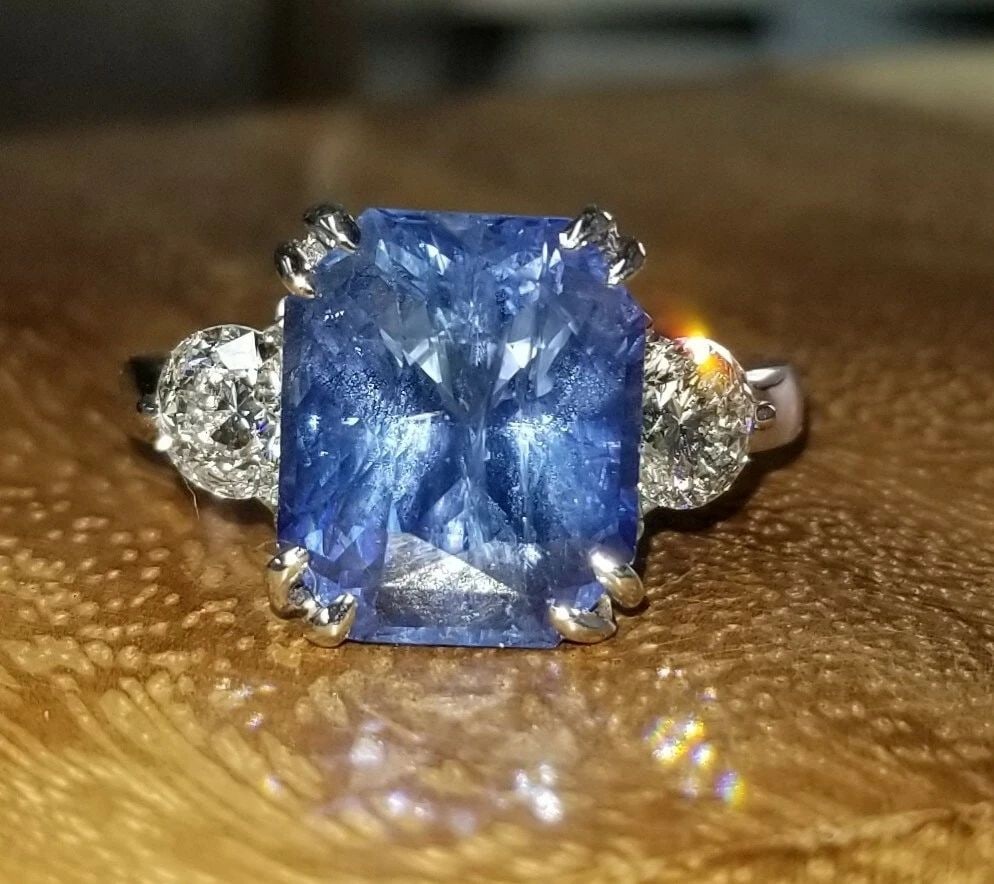 14K WHITE GOLD ENGAGEMENT RING 7.29CT. NATURAL BLUE SAPPHIRE RADIANT CUT: 14K WHITE GOLD ENGAGEMENT RING 7.29CT. NATURAL BLUE SAPPHIRE RADIANT CUT GORGEOUS 14K WHITE GOLD engagement ring natural blue sapphire in radiant shape. center natural sapphire in radiant shape weight