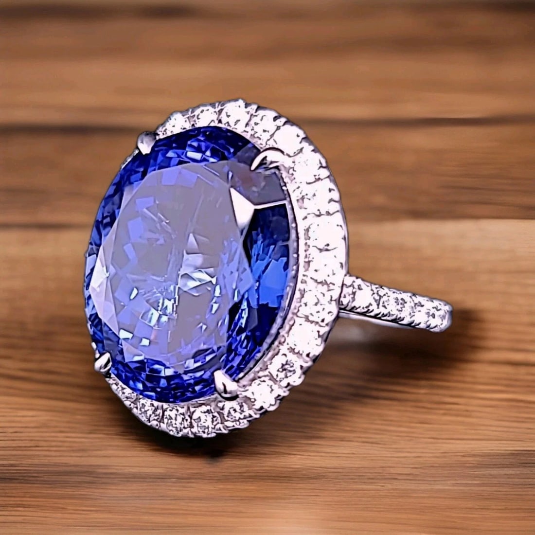 14K WHITE GOLD ENGAGEMENT RING 23.11CT.NATURAL TANZANITE OVAL SHAPE AGL CERT: 14K WHITE GOLD ENGAGEMENT RING 23.11CT.NATURAL TANZANITE OVAL SHAPE AGL CERT Gorgeous 14k white gold engagement tanzanite ring oval shape AGL CERT. Center natural tanzanite in oval shape weight 23.11c