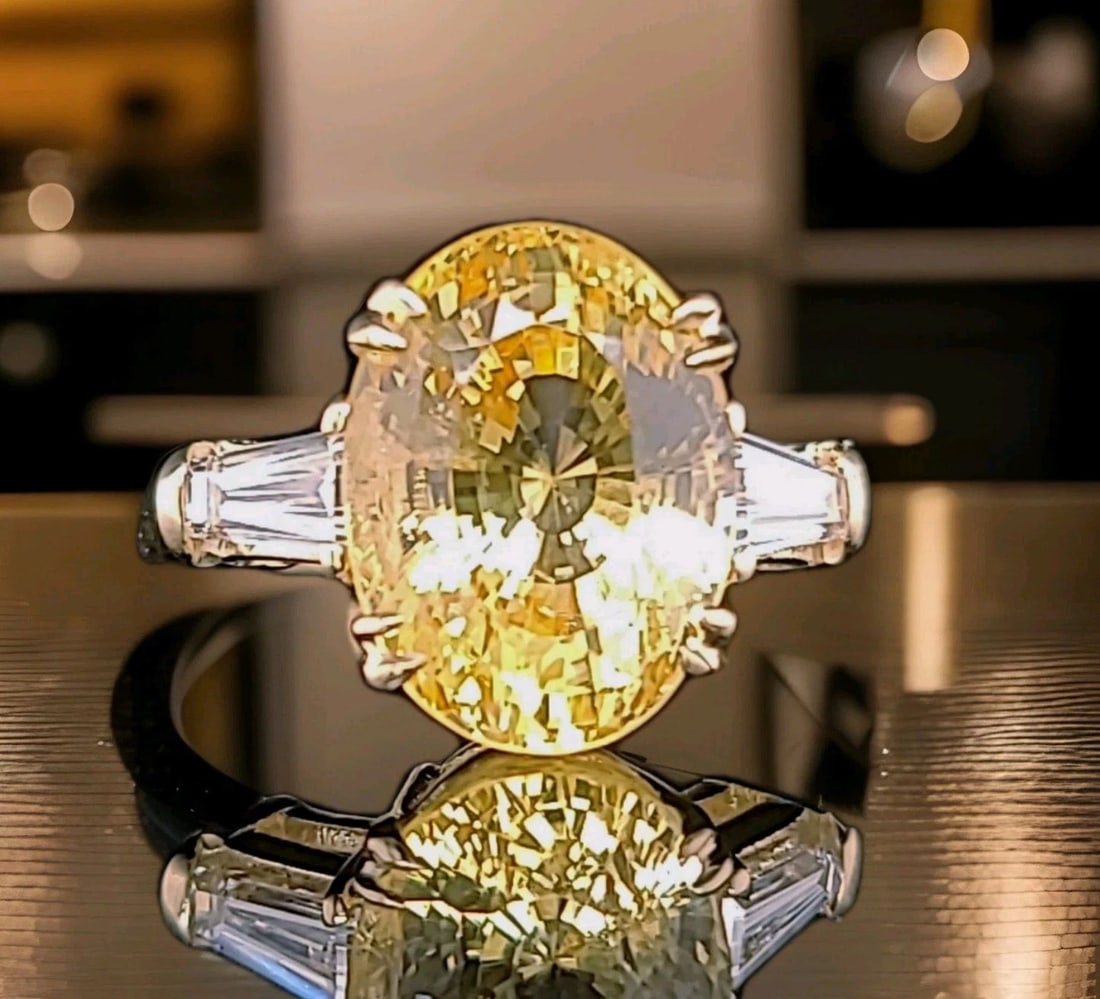 VINTAGE 14K YELLOW GOLD ENGAGEMENT RING 11.70CT NATURAL OVAL YELLOW SAPPHIRE GIA: VINTAGE 14K YELLOW GOLD ENGAGEMENT RING 11.70CT NATURAL OVAL YELLOW SAPPHIRE GIA This vintage 14k yellow gold engagement ring features an 11.70ct natural oval yellow sapphire as the main stone, with t