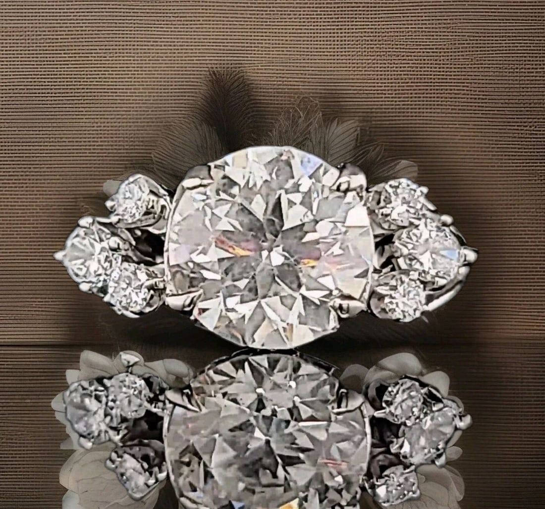 VINTAGE 14K WHITE GOLD ENGAGEMENT RING 3.35CT. NATURAL EURO CUT ROUND DIAMOND: VINTAGE 14K WHITE GOLD ENGAGEMENT RING 3.35CT. NATURAL EURO CUT ROUND DIAMOND This vintage 14k white gold engagement ring features a 3.35CT natural Euro cut round clarity enhanced diamond as the main