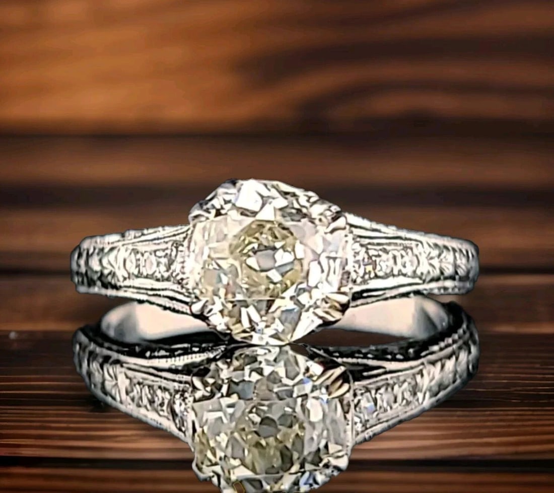 1.42CT. VINTAGE OLD MINE CUT DIAMOND PLATINUM ENGAGEMENT RING CIRC 1920S: 1.42CT. VINTAGE OLD MINE CUT DIAMOND PLATINUM ENGAGEMENT RING CIRC 1920S Add a touch of elegance to your collection with this stunning vintage engagement ring. The ring features a gorgeous 1.57 total