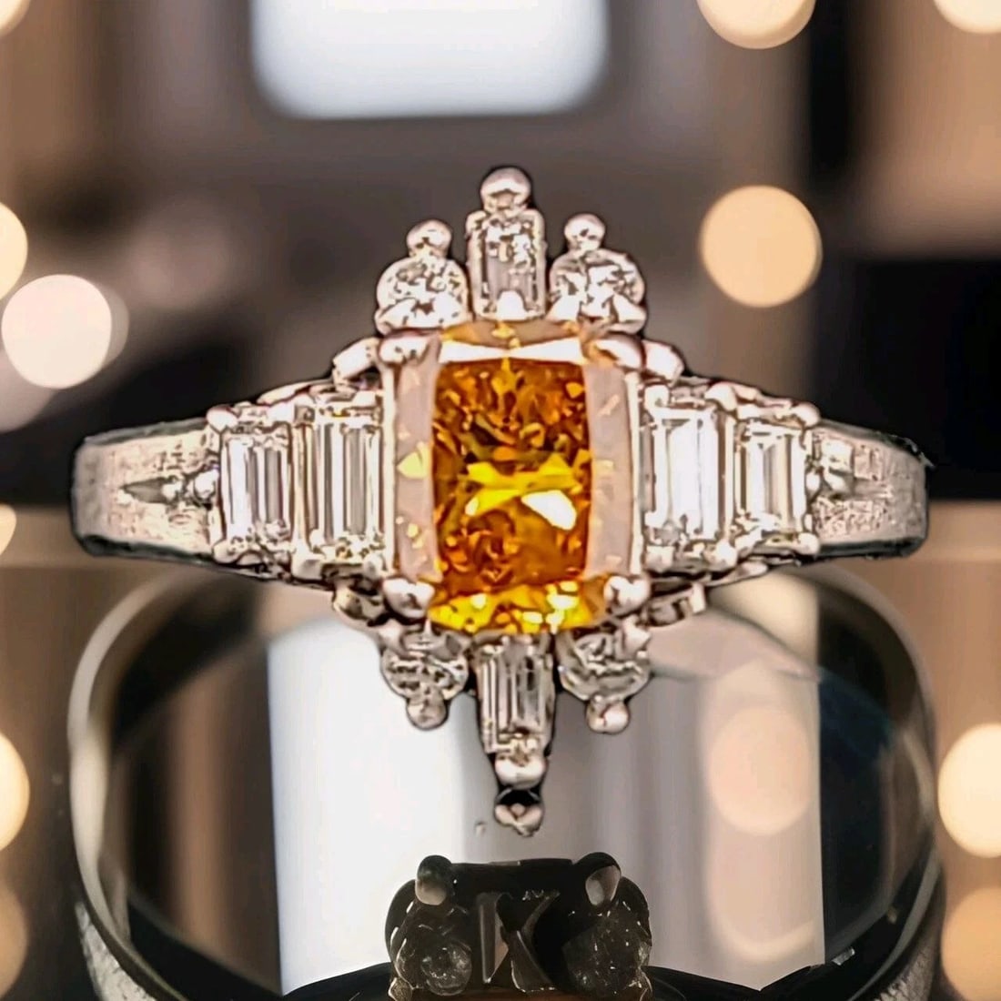 PLATINUM VINTAGE RING 0.80CT.NATURAL FANCY ORANGE YELLOW DIAMOND CUSHION CUT GIA: PLATINUM VINTAGE RING 0.80CT.NATURAL FANCY ORANGE YELLOW DIAMOND CUSHION CUT GIA This Platinum Vintage Ring features a stunning 0.80ct Natural Fancy Orange Yellow Diamond in a Cushion Cut, certified b
