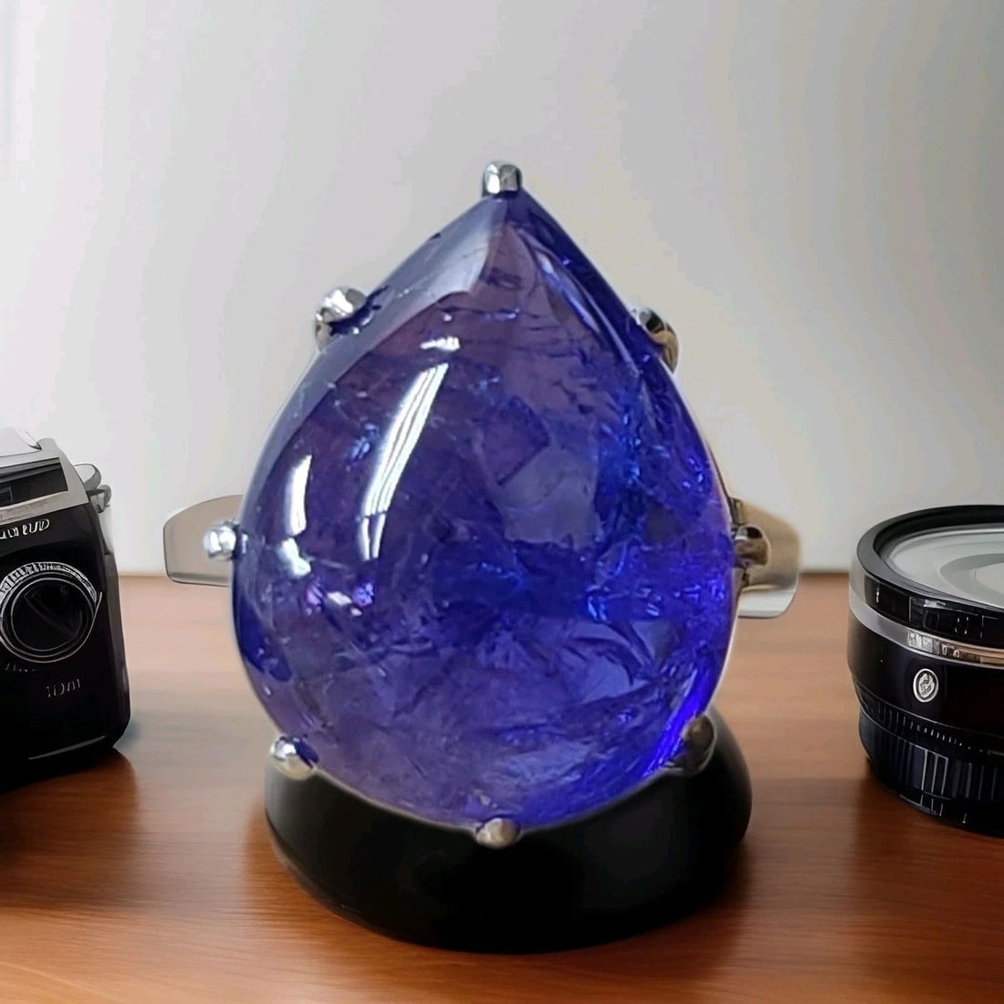 VINTAGE PLATINUM ENGAGEMENT RING 22.02CT.NATURAL TANZANITE PEAR CABOCHON SHAPE: VINTAGE PLATINUM ENGAGEMENT RING 22.02CT.NATURAL TANZANITE PEAR CABOCHON SHAPE This Vintage Platinum Engagement Ring features a stunning natural Tanzanite pear cabochon stone with a total weight of 22