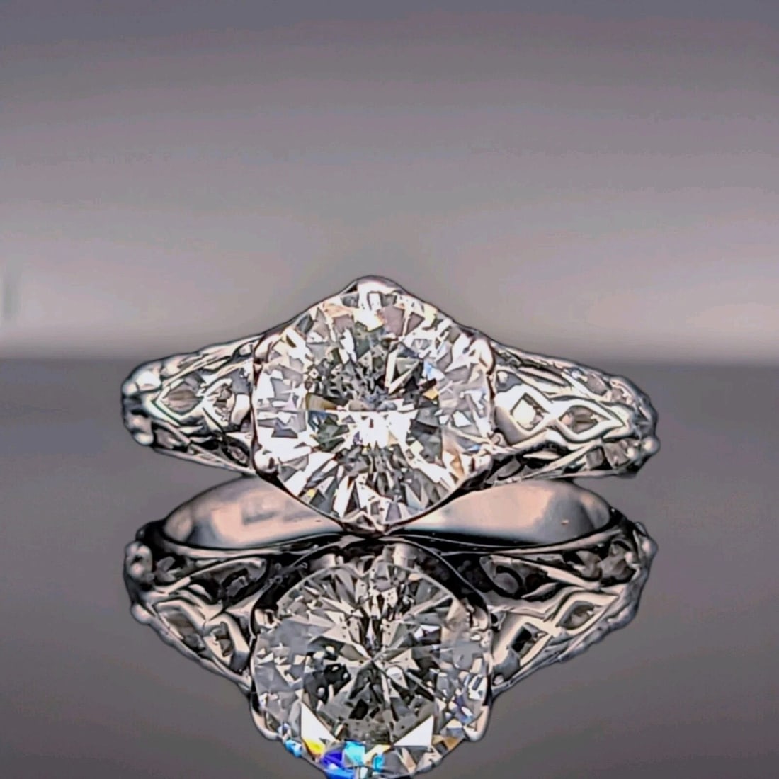 VINTAGE PLATINUM FILIGREE ENGAGEMENT RING 1.43CT. NATURAL ROUND DIAMOND EGL CERT: 18K WHITE GOLD FILIGREE ENGAGEMENT RING 1.52CT. NATURAL OLD EURO ROUND DIAMOND This stunning 18k white gold filigree engagement ring showcases a beautiful 1.52ct natural old Euro round diamond. The an