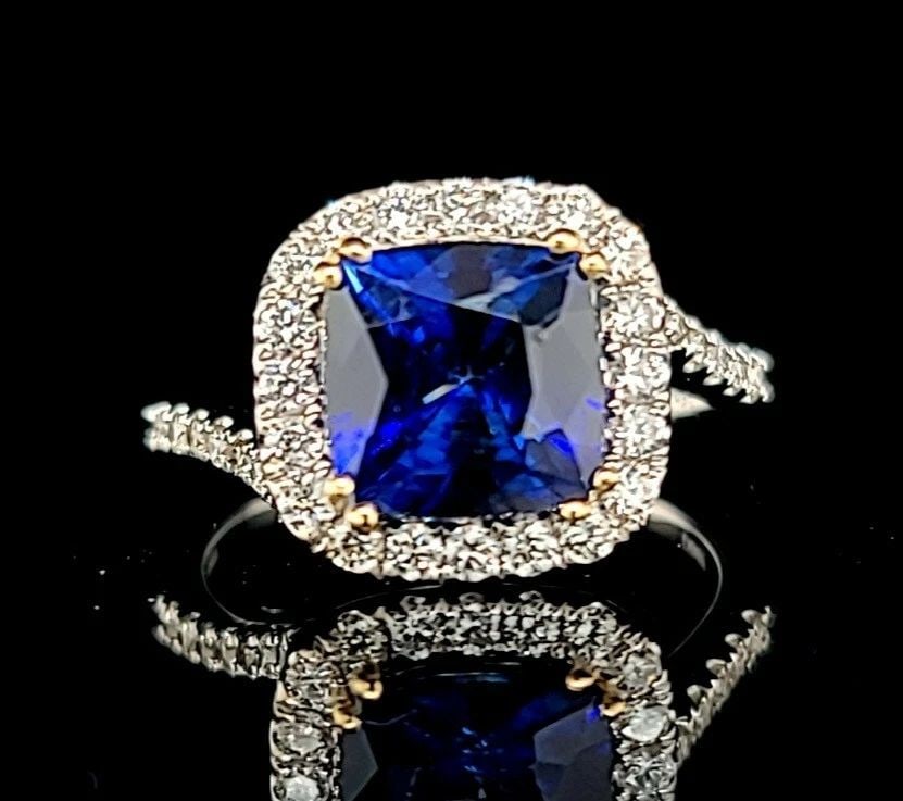 18K WHITE & YELLOW GOLD ENGAGEMENT RING 3.09CT. NATURAL BLUE SAPPHIRE CUSHION: 18K WHITE & YELLOW GOLD ENGAGEMENT RING 3.09CT. NATURAL BLUE SAPPHIRE CUSHION GORGEOUS 18k white & Yellow gold sapphire engagement ring center natural treated diffused blue sapphire cushion shape weig
