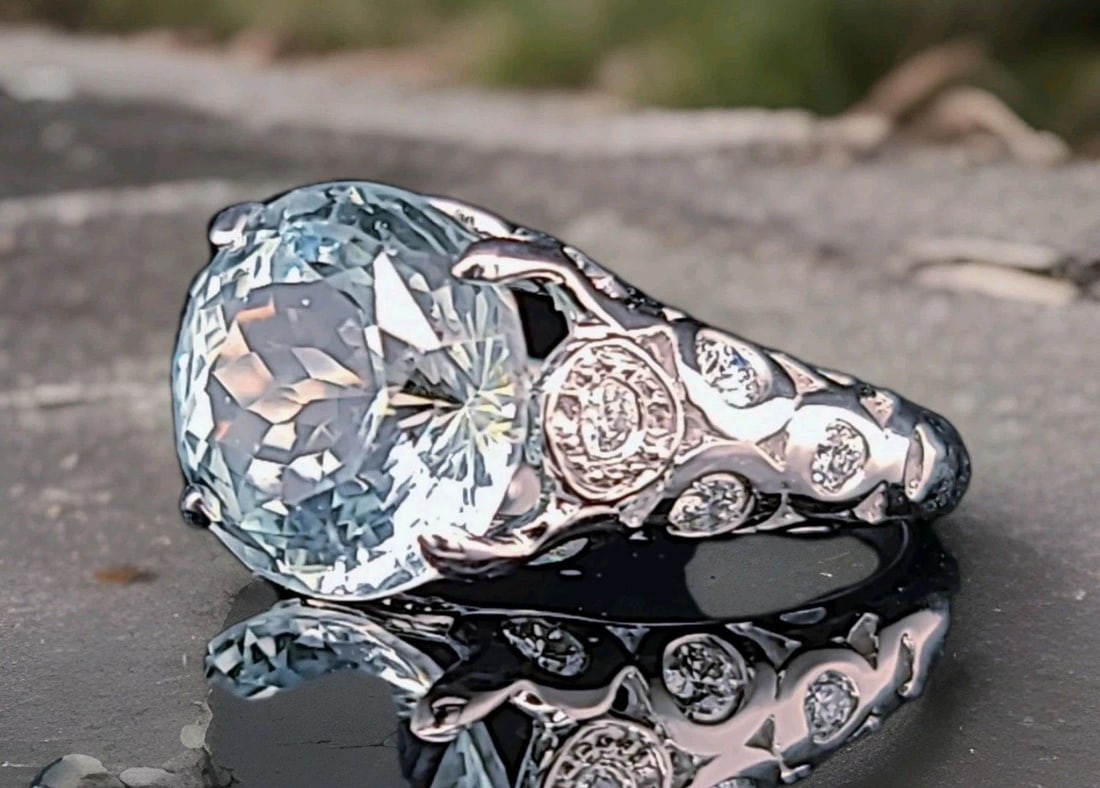 VINTAGE 14K WHITE GOLD ENGAGEMENT RING 7.61CT. NATURAL SKY BLUE AQUAMARINE ROUND: VINTAGE 14K WHITE GOLD ENGAGEMENT RING 7.61CT. NATURAL SKY BLUE AQUAMARINE ROUND This vintage 14K white gold engagement ring features a stunning natural sky blue aquamarine round stone with a total ca