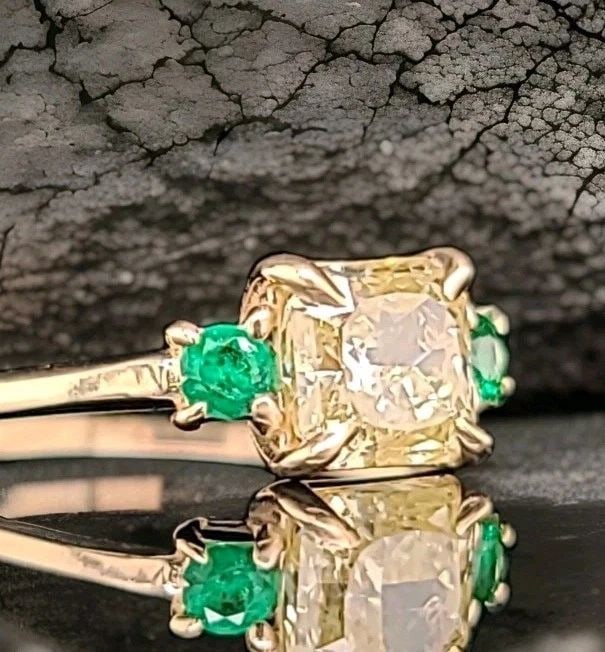 14K YELLOW GOLD VINTAGE ENGAGEMENT RING 1.17CT.NATURAL YELLOW DIAMOND RADIANT: 14K YELLOW GOLD VINTAGE ENGAGEMENT RING 1.17CT.NATURAL YELLOW DIAMOND RADIANT This 14k Yellow Gold Ring features a 1.17CT Natural Yellow Diamond in a radiant shape, accented with two additional natura