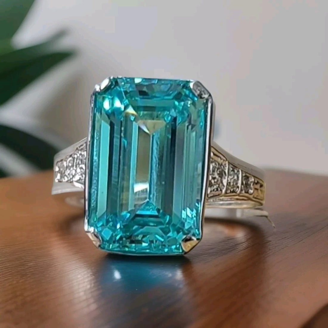 VINTAGE 14K WHITE GOLD RING 8.90CT. LAB GROWN PARAIBA TOURMALINE EMERALD CUT: VINTAGE 14K WHITE GOLD RING 8.90CT. NEON BLUE PARAIBA TOURMALINE RECTANGULAR CUT This vintage ring is a stunning addition to any jewelry collection. The 14k white gold band holds a lab-grown, emerald-
