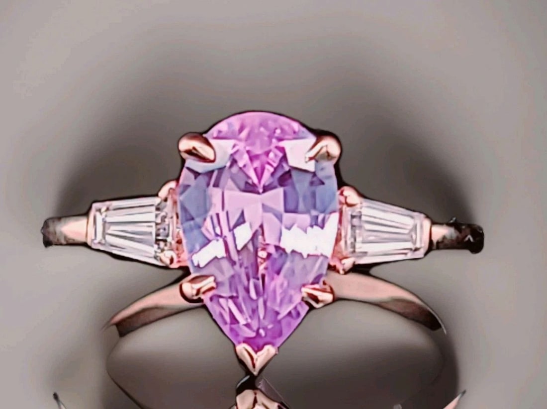 VINTAGE 14K ROSE GOLD ENGAGEMENT RING 2.09CT.NATURAL PINK SAPPHIRE PEAR CUT GIA: VINTAGE 14K ROSE GOLD ENGAGEMENT RING 2.09CT.NATURAL PINK SAPPHIRE PEAR CUT GIA This vintage 14k rose gold engagement ring features a beautiful 2.09CT natural pink sapphire in a pear cut, with two dia