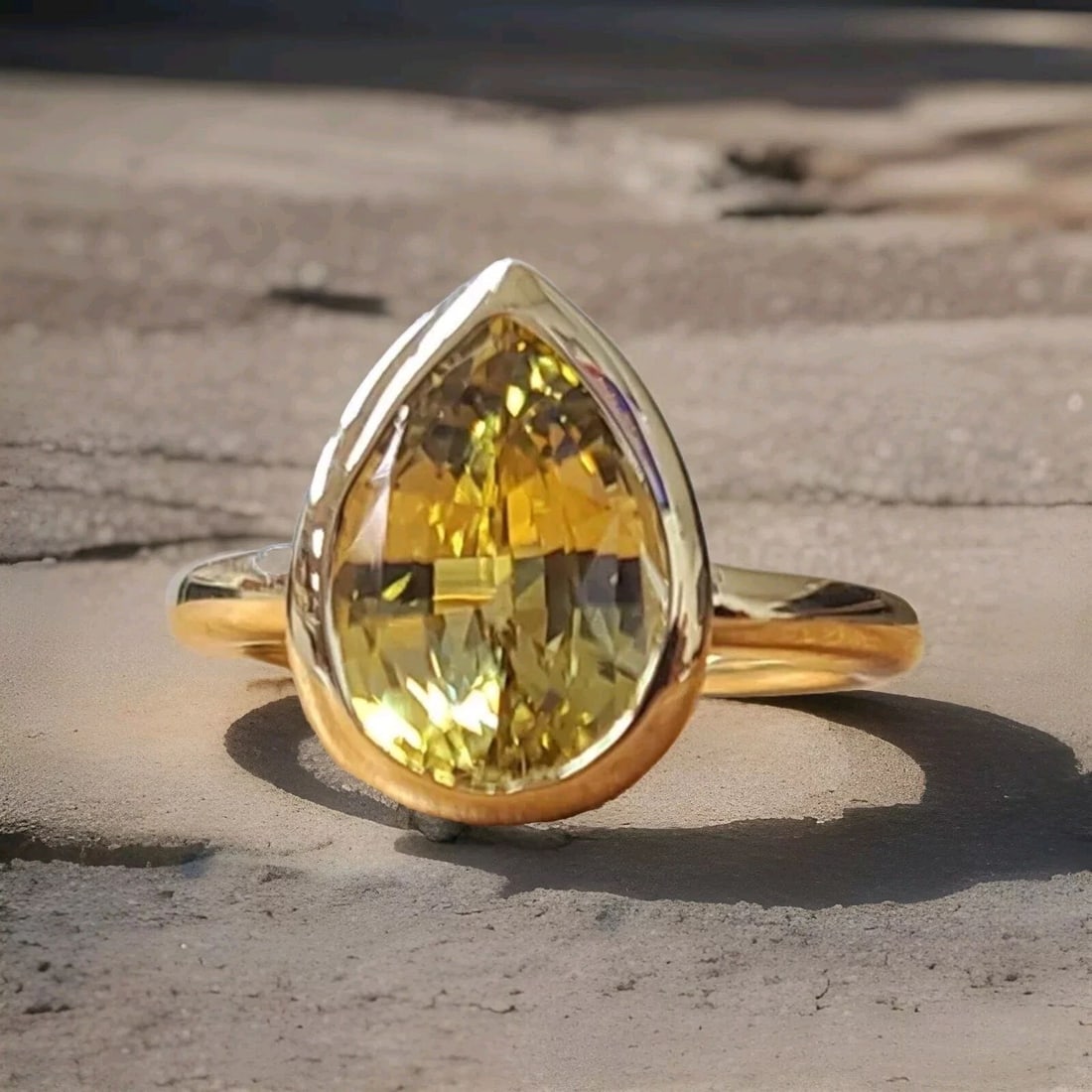 VINTAGE 14K YELLOW GOLD ENGAGEMENT RING 3.54 CT. NATURAL YELLOW SAPPHIRE: VINTAGE 14K YELLOW GOLD ENGAGEMENT RING 3.54 CT. NATURAL YELLOW SAPPHIRE This stunning vintage ring is crafted from 14k yellow gold and features a 3.54CT natural yellow sapphire in pear cut and, a gor