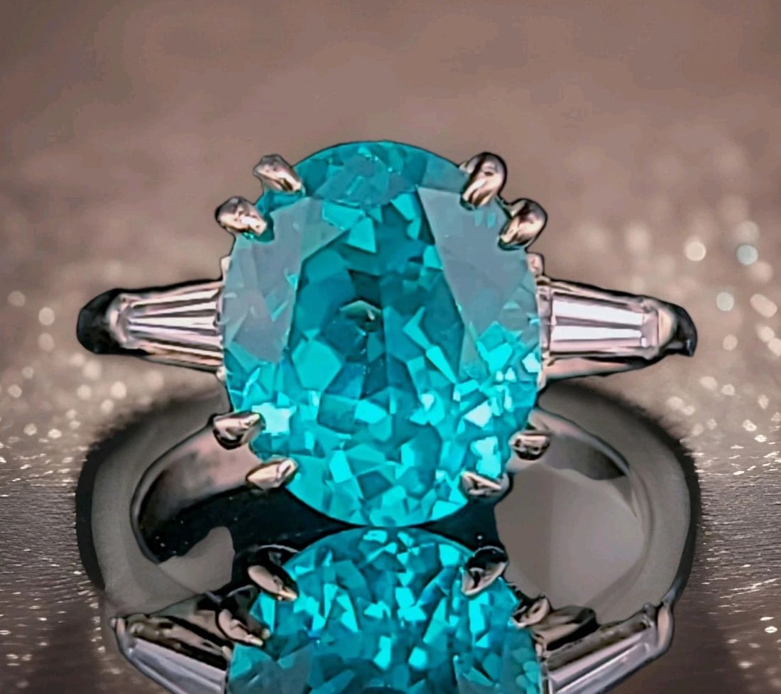 VINTAGE 14K WHITE GOLD ENGAGEMENT RING 7.53CT. BLUE TOURMALINE OVAL SHAPE: VINTAGE 14K WHITE GOLD ENGAGEMENT RING 7.53CT. BLUE TOURMALINE OVAL SHAPE This vintage 14K white gold engagement ring features a stunning 7.53CT lab-grown blue tourmaline oval shape as the main stone,