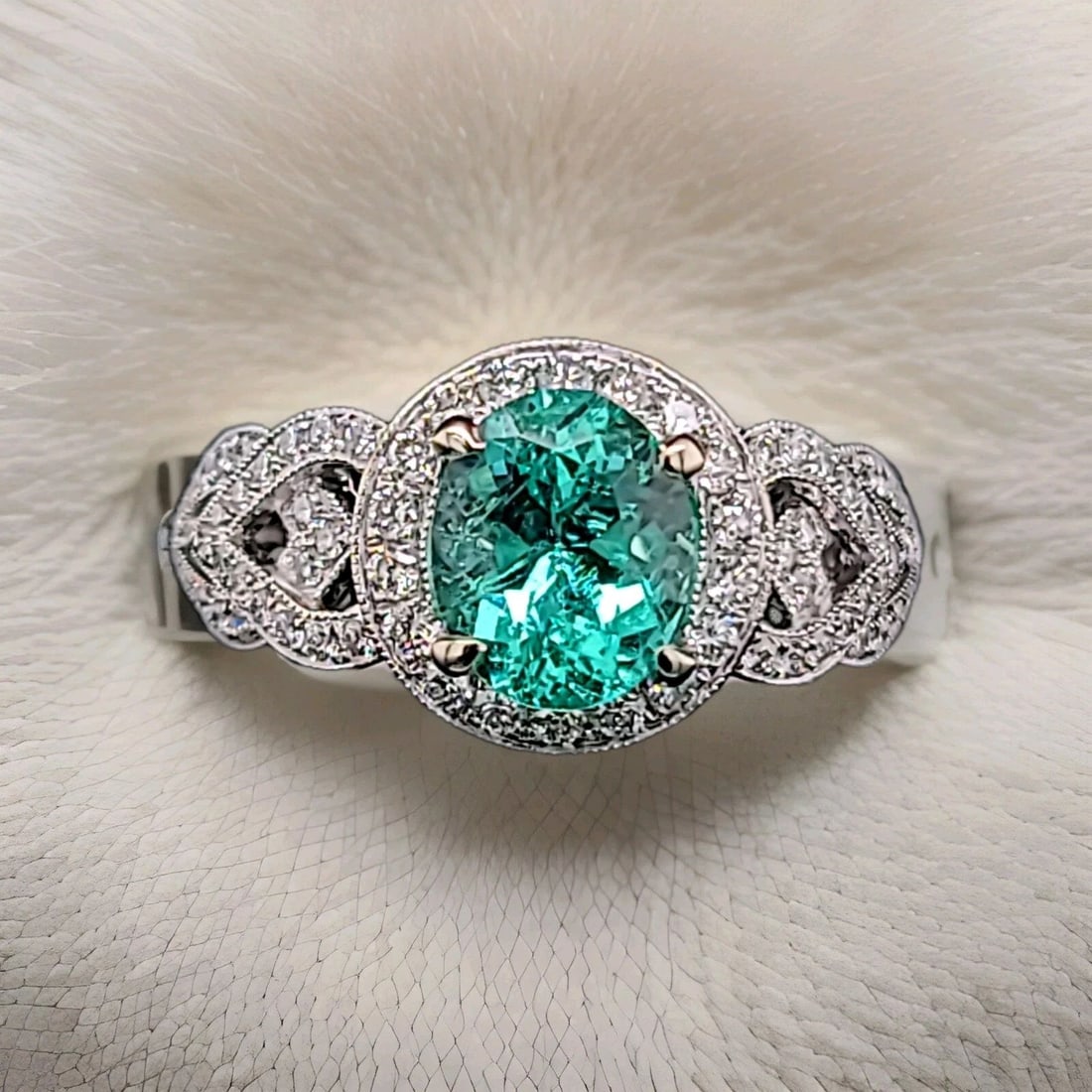 18K WHITE GOLD ENGAGEMENT RING 1.62CT. NATURAL GREEN COLOMBIA EMERALD OVAL SHAPE: 18K WHITE GOLD ENGAGEMENT RING 1.62CT. NATURAL GREEN COLOMBIA EMERALD OVAL SHAPE This 18K White Gold Engagement Ring features a stunning 1.62CT Natural Green Colombia Emerald in an oval shape. Surroun