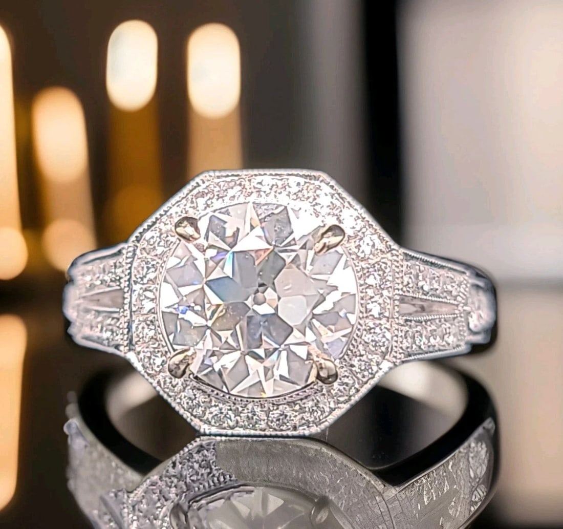 VINTAGE 18K WHITE GOLD ENGAGEMENT RING 3.08CT.OLD EURO CUT LAB-GROWN DIAMOND: VINTAGE 18K WHITE GOLD ENGAGEMENT RING 3.08CT.OLD EURO CUT LAB-GROWN DIAMOND This vintage 18k white gold engagement ring features a stunning 3.08ct lab-grown diamond with an old Euro cut. The round co
