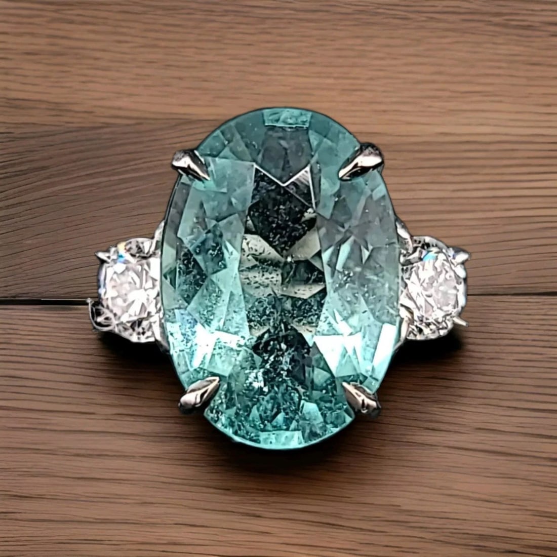 14K WHITE GOLD ENGAGEMENT RING 7.08CT.NATURAL NEON TOURMALINE OVAL SHAPE: 14K WHITE GOLD ENGAGEMENT RING 7.08CT.NATURAL NEON TOURMALINE OVAL SHAPE Gorgeously 14k white gold engagement ring with natural neon tourmaline oval shape Center Gem natural neon bluish green (paraiba