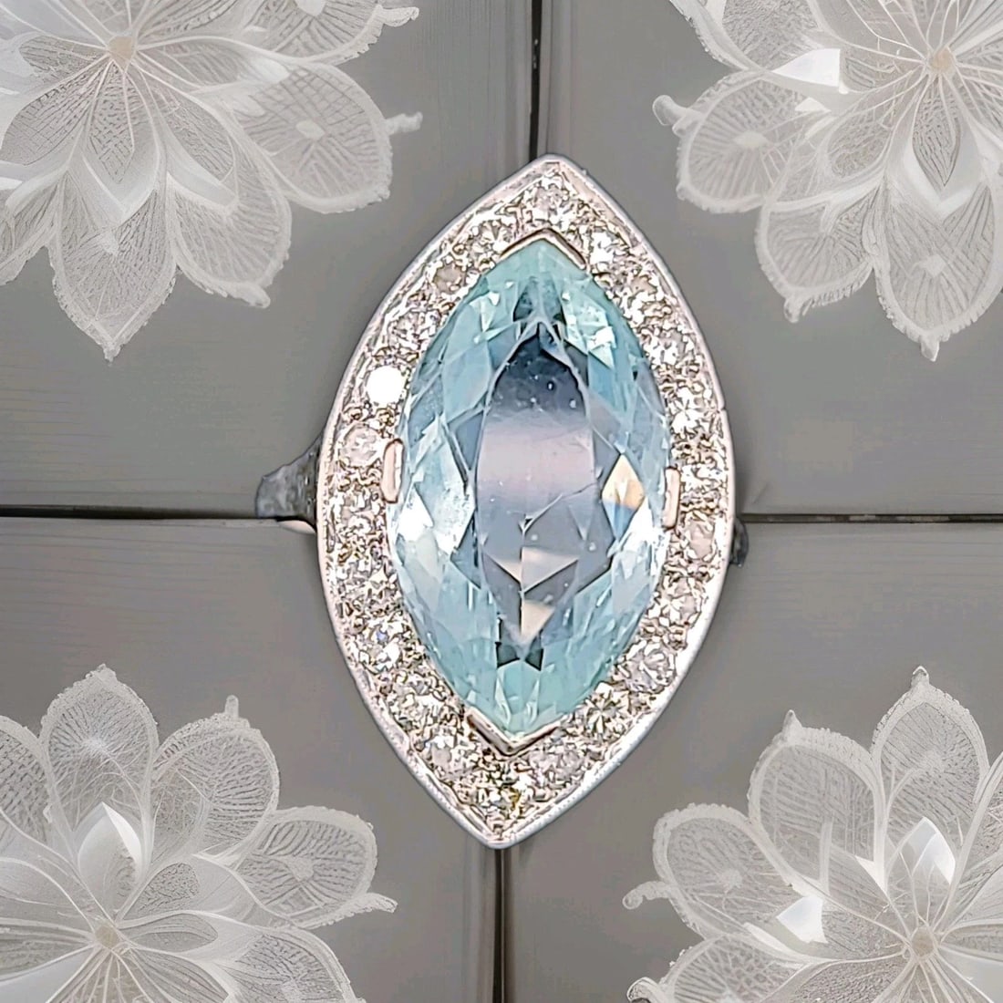 VINTAGE PLATINUM ENGAGEMENT RING 5.50CT.NATURAL SKY BLUE MARQUISE AQUAMARINE: VINTAGE PLATINUM ENGAGEMENT RING 5.50CT.NATURAL SKY BLUE MARQUISE AQUAMARINE This Vintage Platinum Engagement Ring features a stunning 5.50ct marquise-cut natural sky blue aquamarine as the main stone