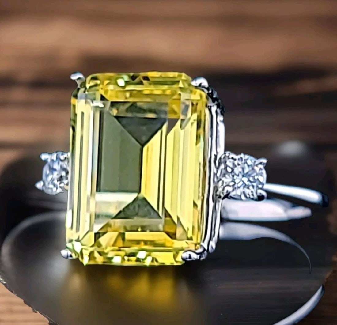 VINTAGE 14K WHITE GOLD ENGAGEMENT RING 9.39CT. LAB GROWN YELLOW SAPPHIRE: VINTAGE 14K WHITE GOLD ENGAGEMENT RING 9.39CT. YELLOW SAPPHIRE EMERALD SHAPE Gorgeous vintage 14k white gold engagement ring gem lab-grown yellow sapphire in an emerald shape Center set yellow sapphir