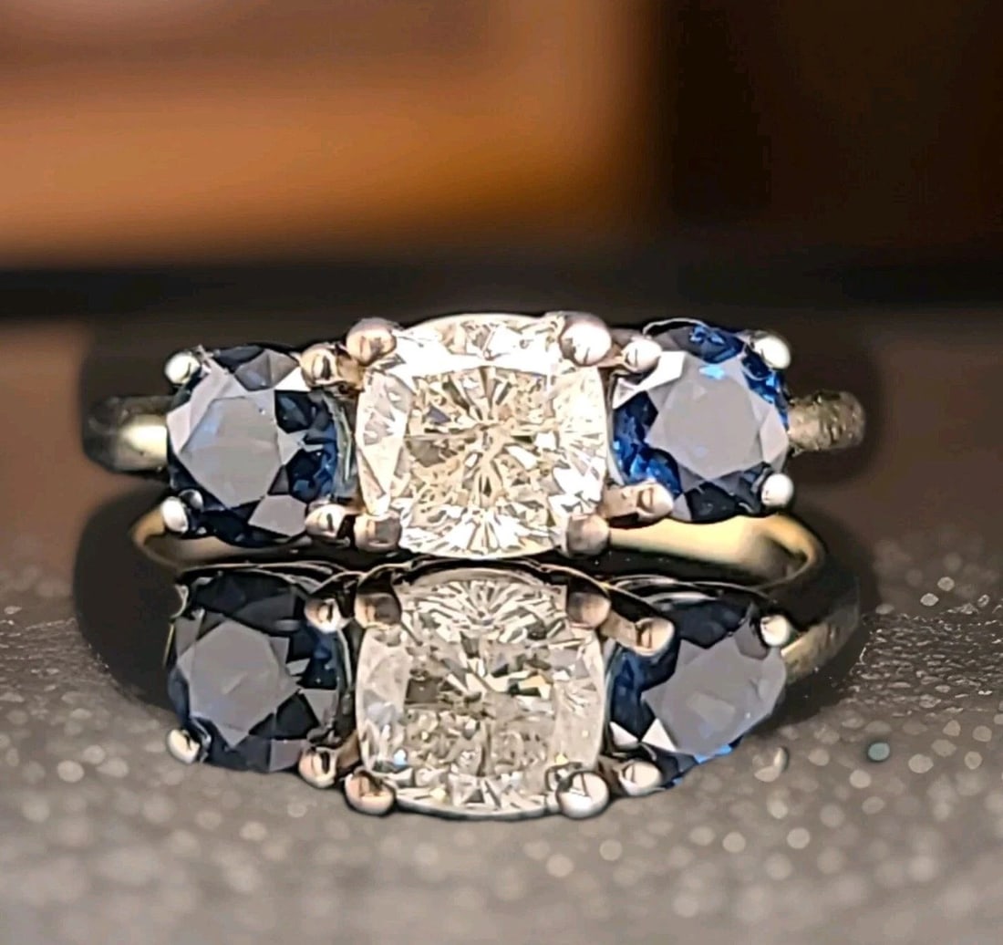 VINTAGE 14K TWO-TONE GOLD ENGAGEMENT RING 1.90CT.NATURAL DIAMOND BLUE SAPPHIRE: VINTAGE 14K TWO-TONE GOLD ENGAGEMENT RING 1.90CT.NATURAL DIAMOND BLUE SAPPHIRE Vintage three-stone engagement 14k two-tone gold ring. circ 1940's Center natural cushion cut diamond WEIGHT 1.02CT SIZE