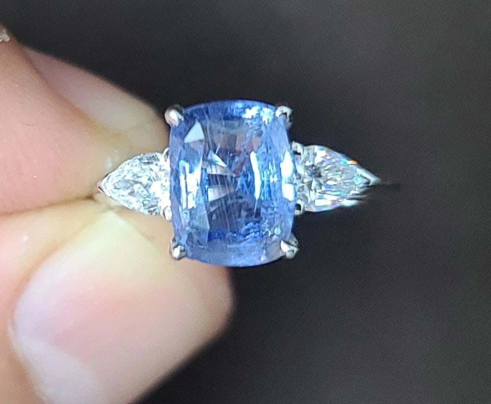 14K WHITE GOLD ENGAGEMENT RING 2.71CT. NATURAL BLUE SAPPHIRE CUSHION CUT: 14K WHITE GOLD ENGAGEMENT RING 2.71CT. NATURAL BLUE SAPPHIRE CUSHION CUT Gorgeous 14k white gold natural blue sapphire engagement ring center natural blue sapphire in cushion shape weight 2.71ct. Size