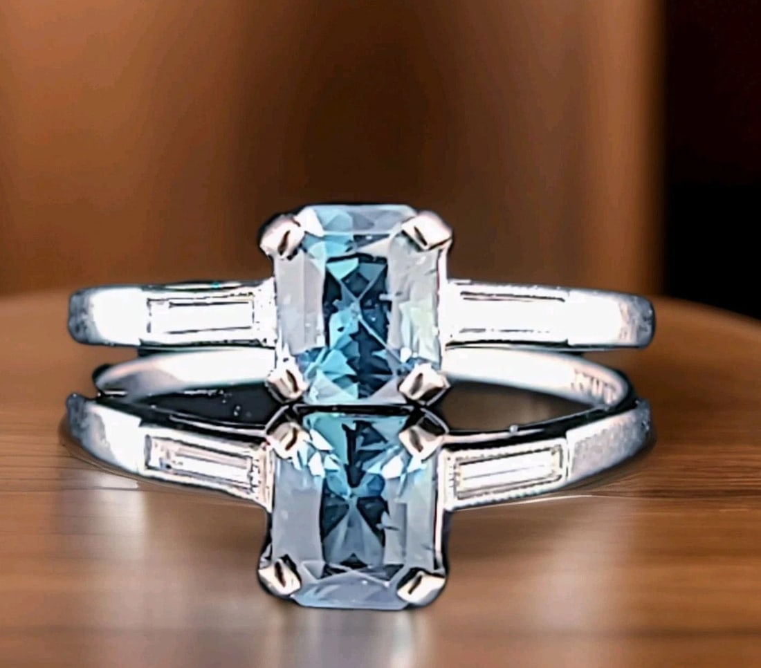 PLATINUM VINTAGE ENGAGEMENT RING 1.12CT.NATURAL TEAL BLUE SAPPHIRE GIA CERT: PLATINUM VINTAGE ENGAGEMENT RING 1.12CT.NATURAL TEAL BLUE SAPPHIRE GIA CERT This Platinum Vintage Engagement Ring features a stunning 1.12ct Natural Teal Blue Sapphire as the main stone, with two spar